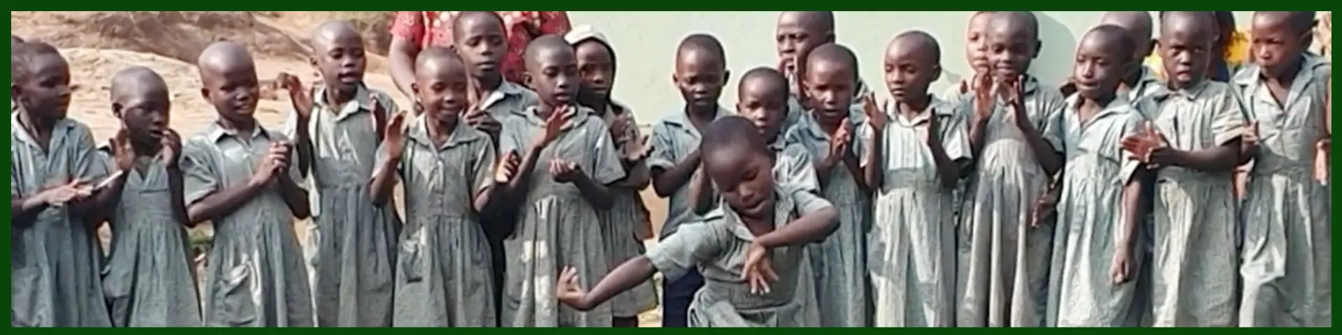 Schoolgirls dancing outside their classroom